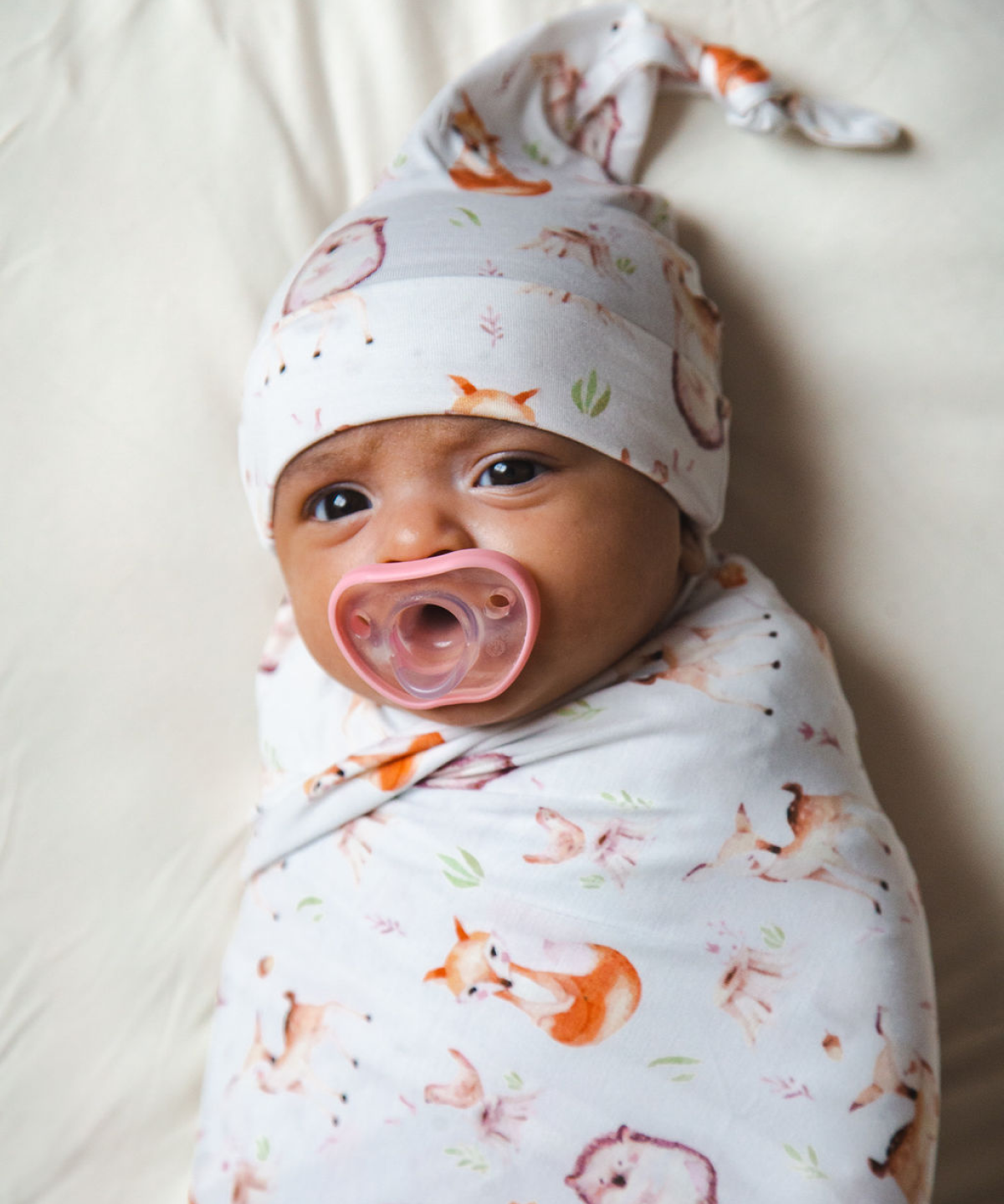 Baby in a swaddle with pacifier