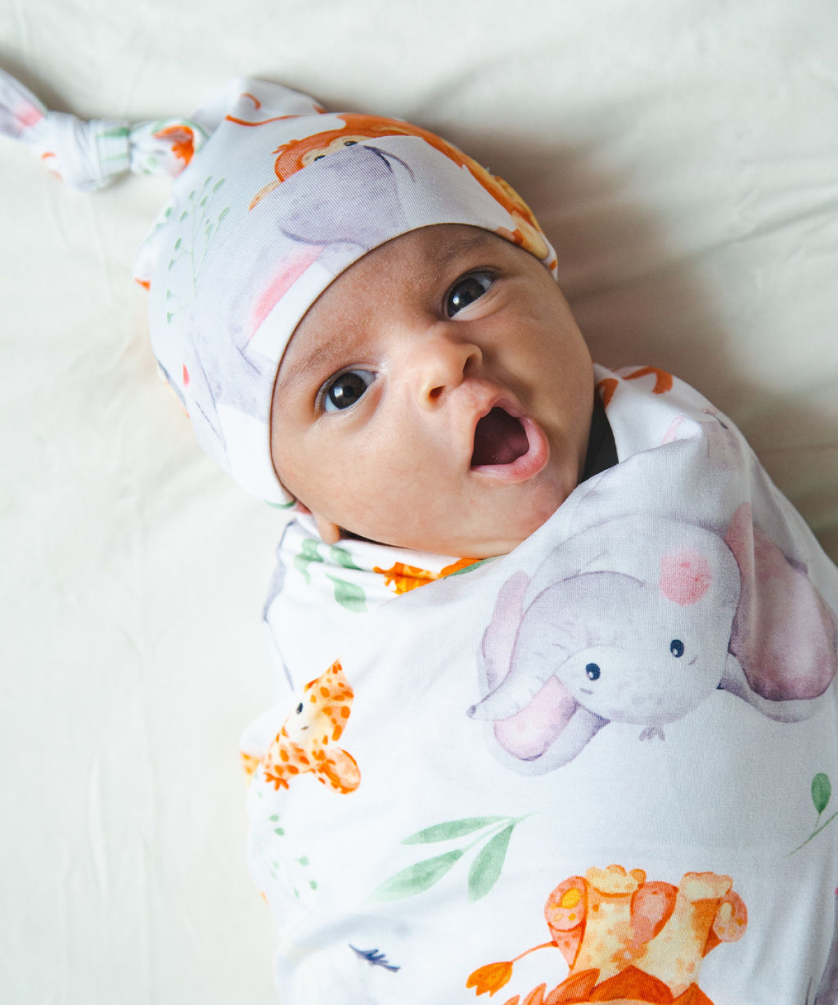 Baby in a swaddle yawning